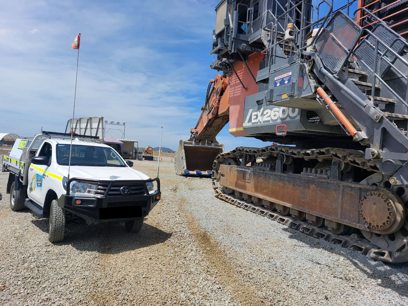 A tractor cab with clear windows is sitting in a field — Australian Specialised Machinery Glass In Townsville, QLD