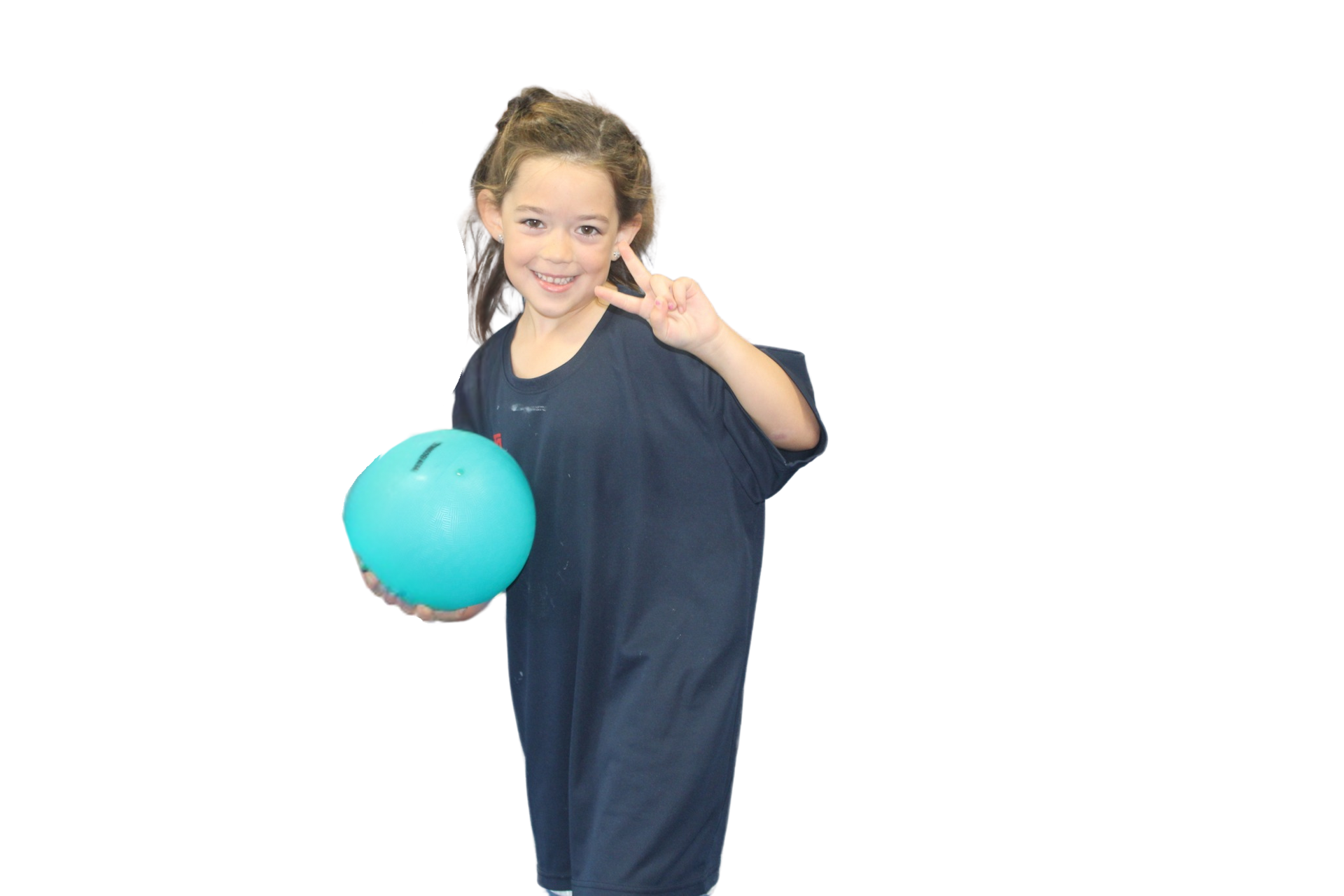 A boy wearing a party hat is laying on the floor with balloons and giving a thumbs up