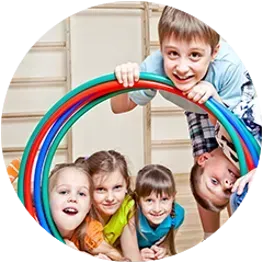 A group of children are playing with a hula hoop.