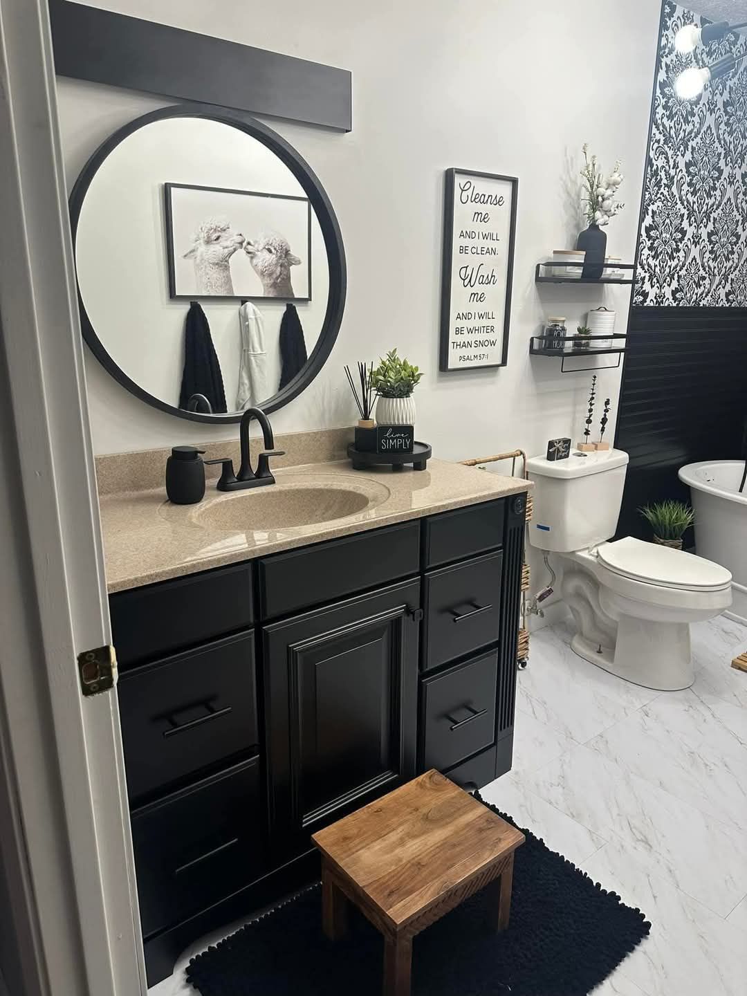 A bathroom with a sink , toilet , and mirror.