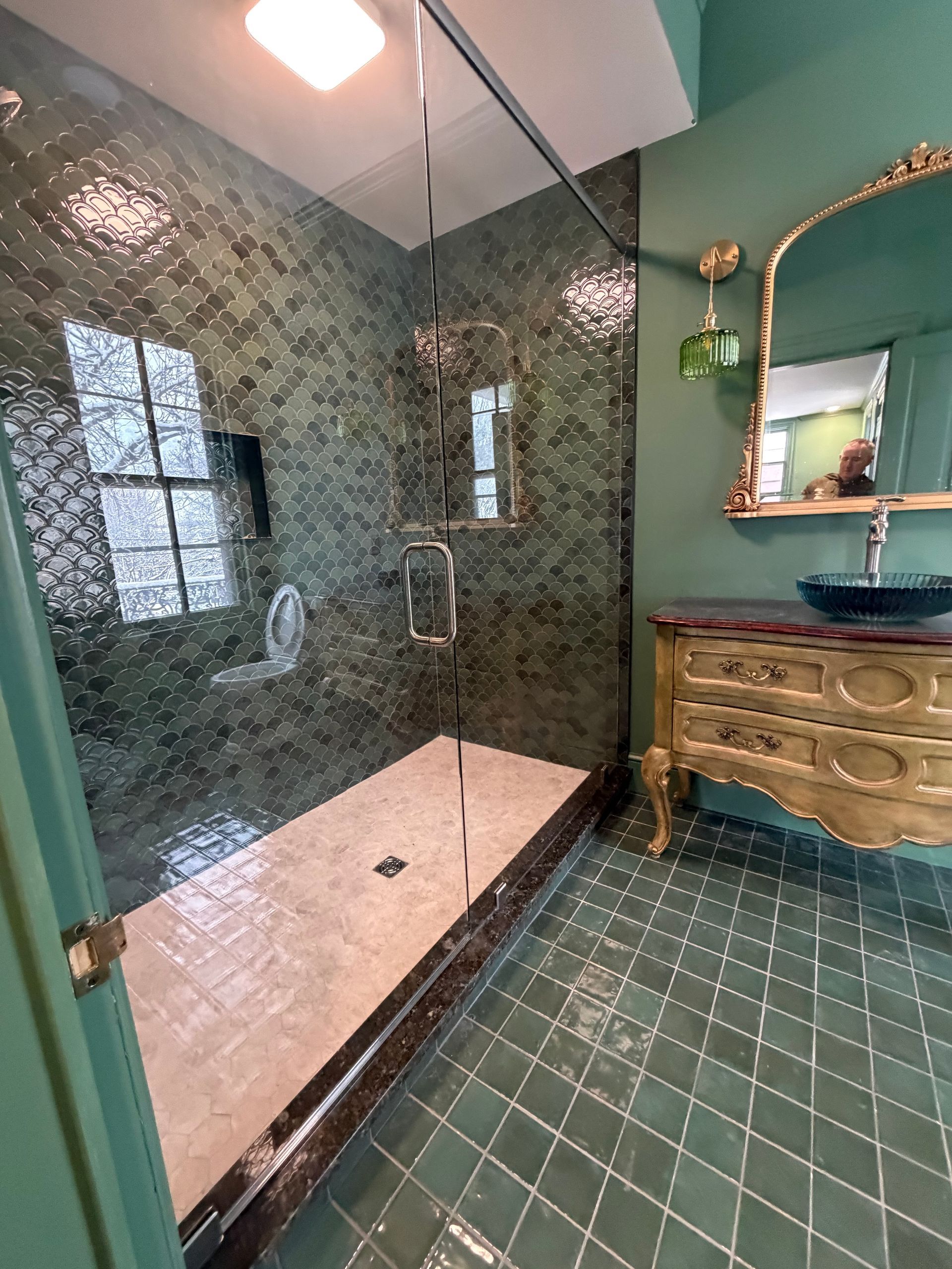 Master Bathroom Remodel Lancaster PA | Green custom tile shower with glass door and backsplash with antique vanity