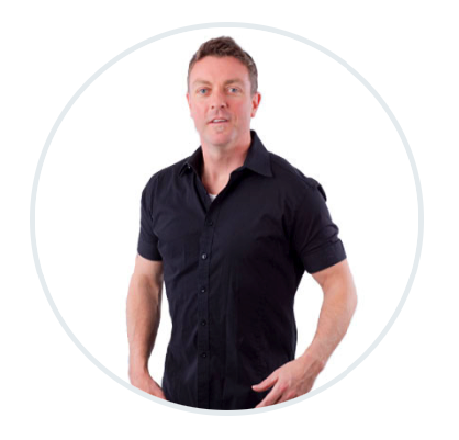 A man in a black shirt is standing in a circle with his hands on his hips