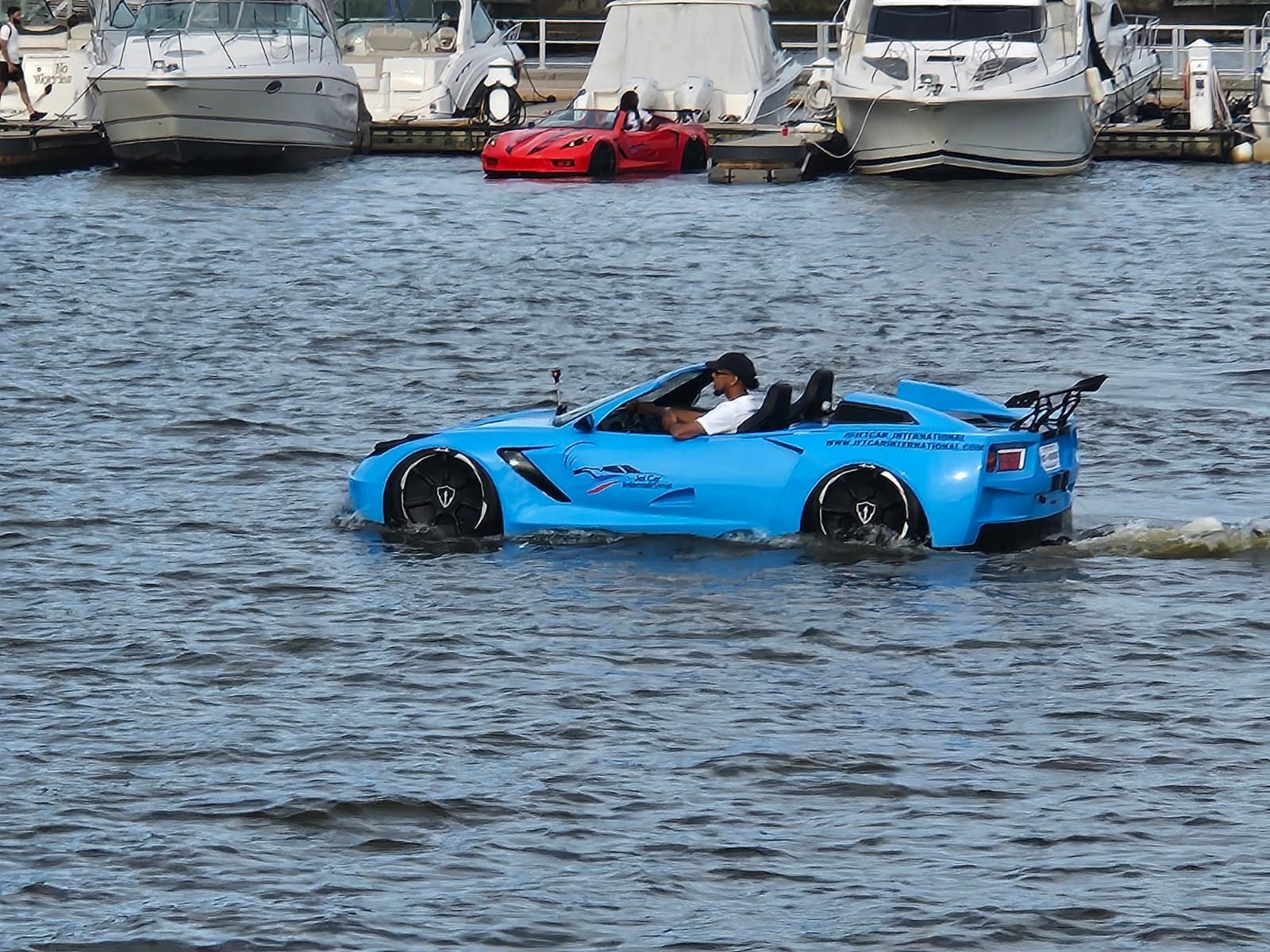 A boat that looks like a blue race car on the water | Open houses DC