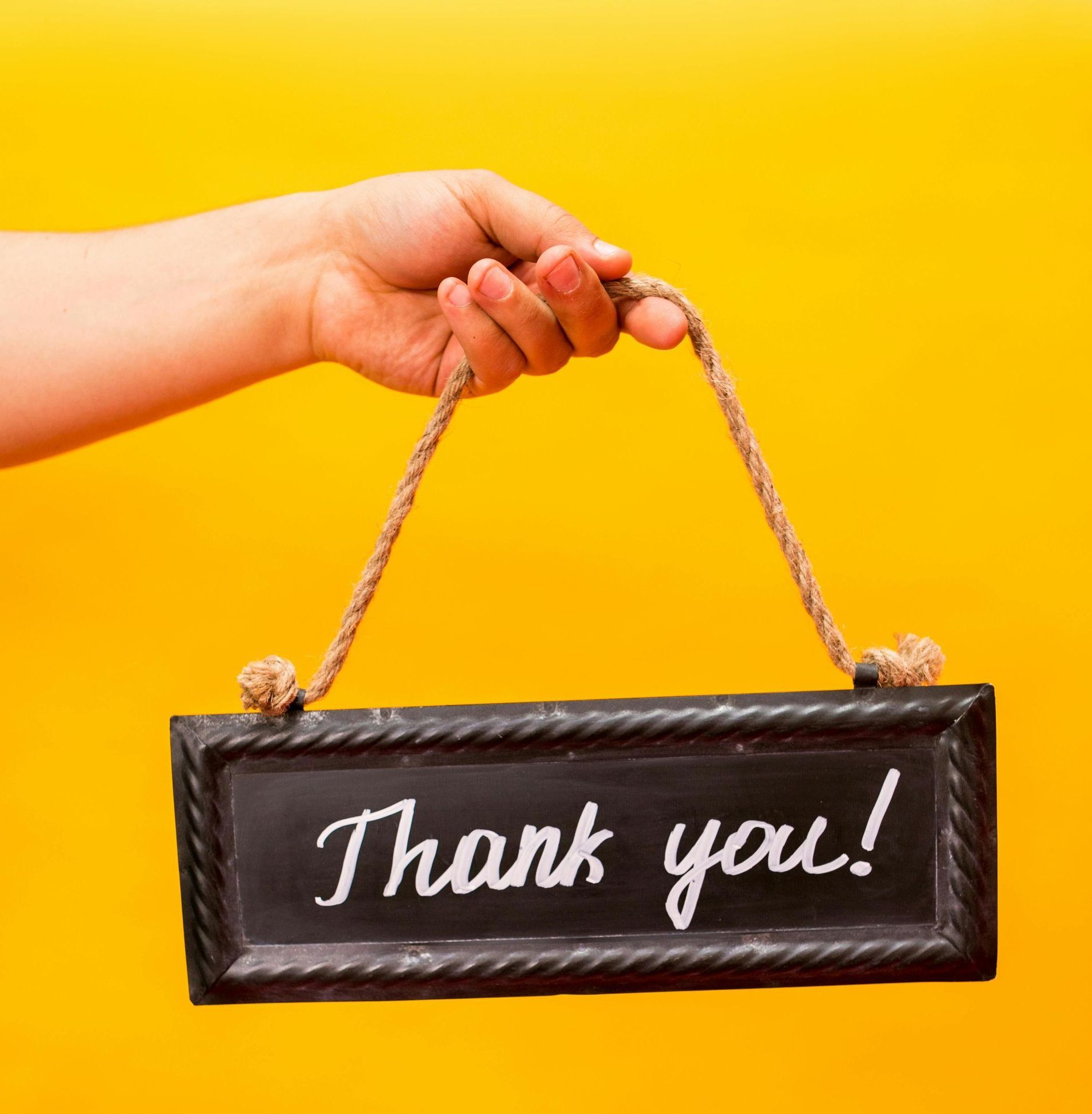 Hand holding Thank You! sign