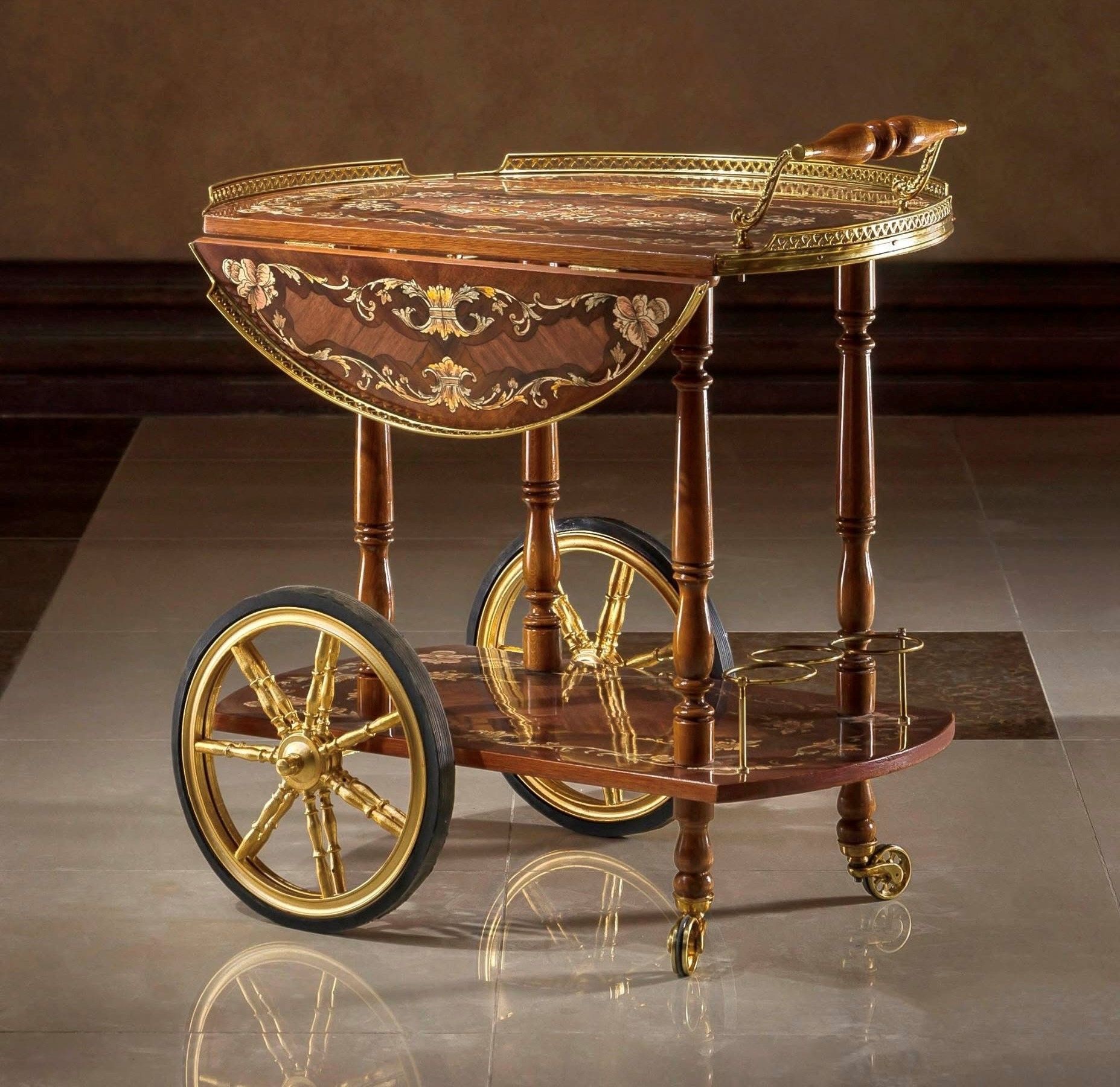 A wooden cart with gold wheels sits on a tiled floor