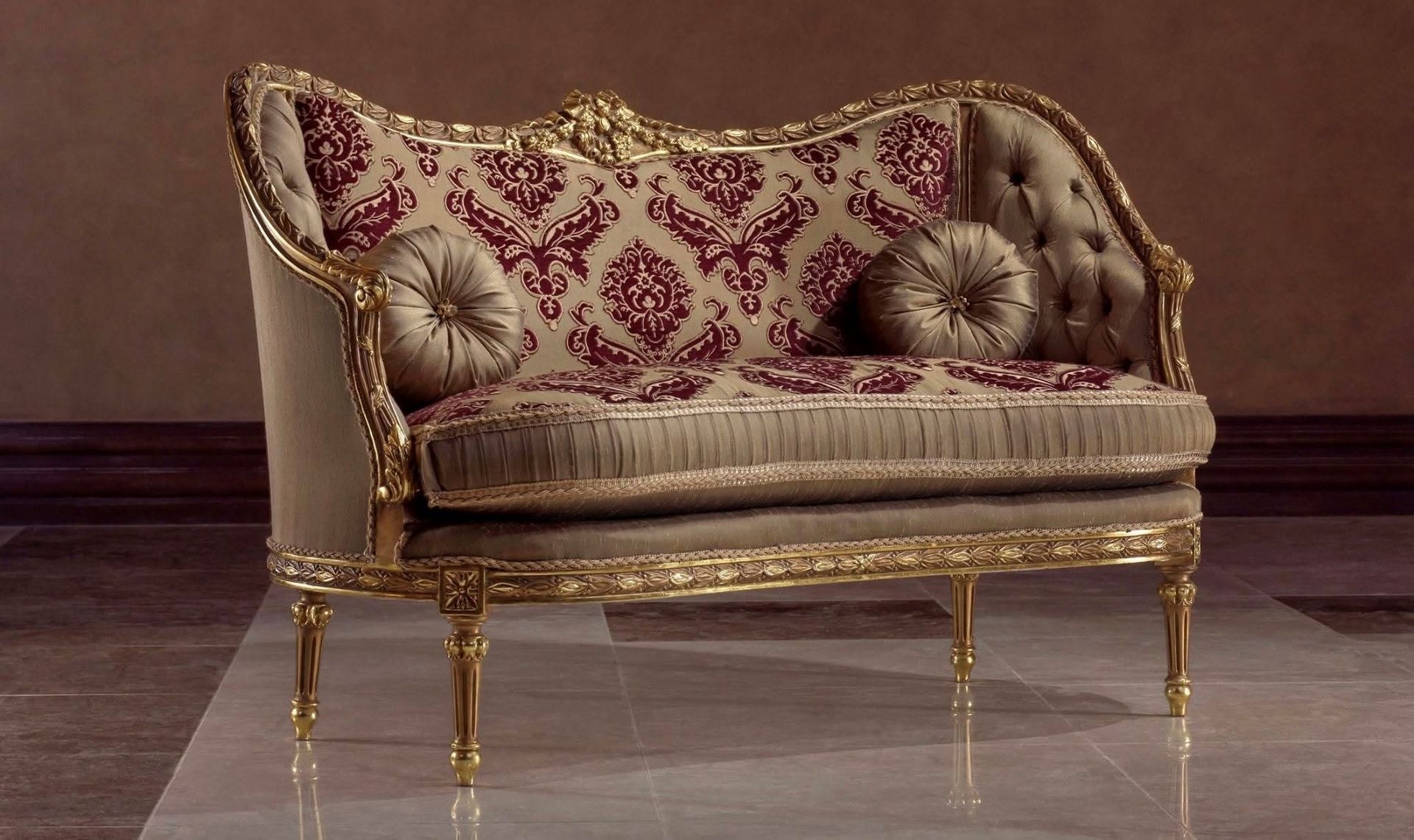 A couch is sitting on a tiled floor in a room