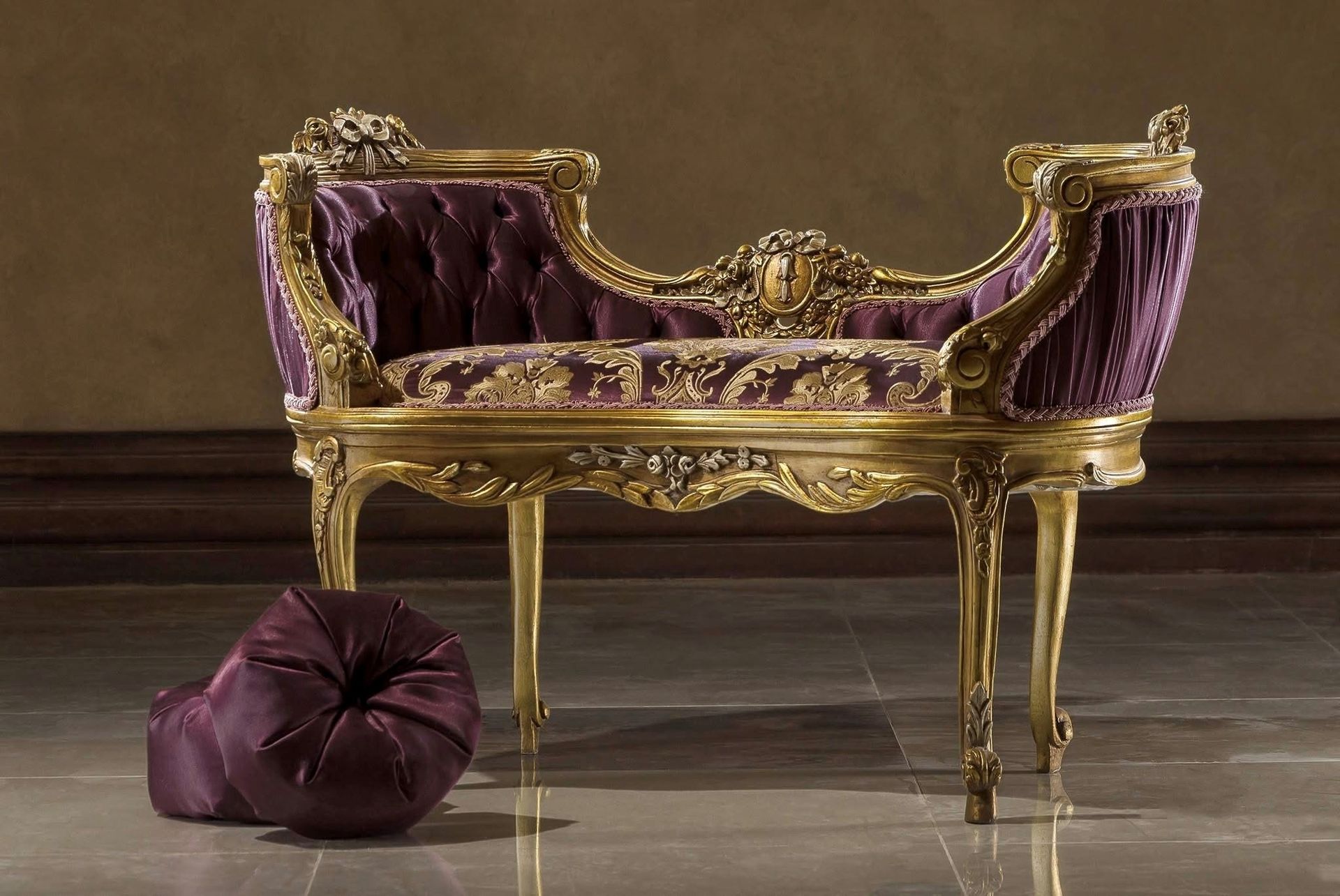 A purple and gold bench with a purple pillow next to it