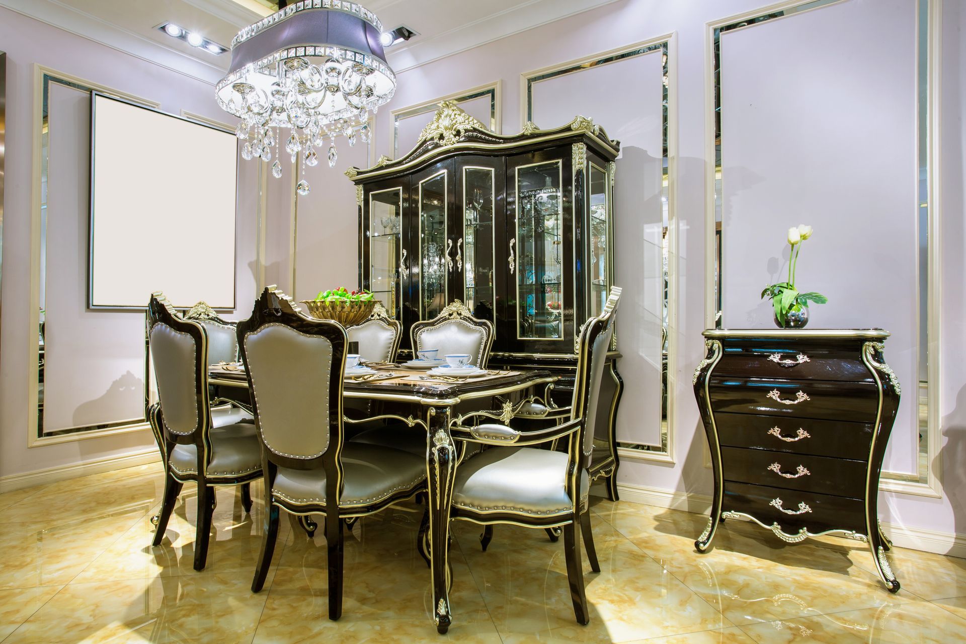 A dining room with a table and chairs and a chandelier