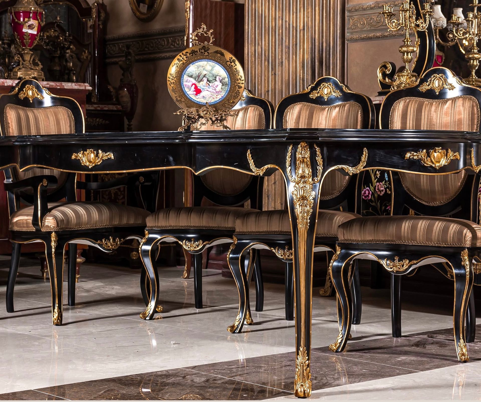 A black and gold dining table and chairs in a room