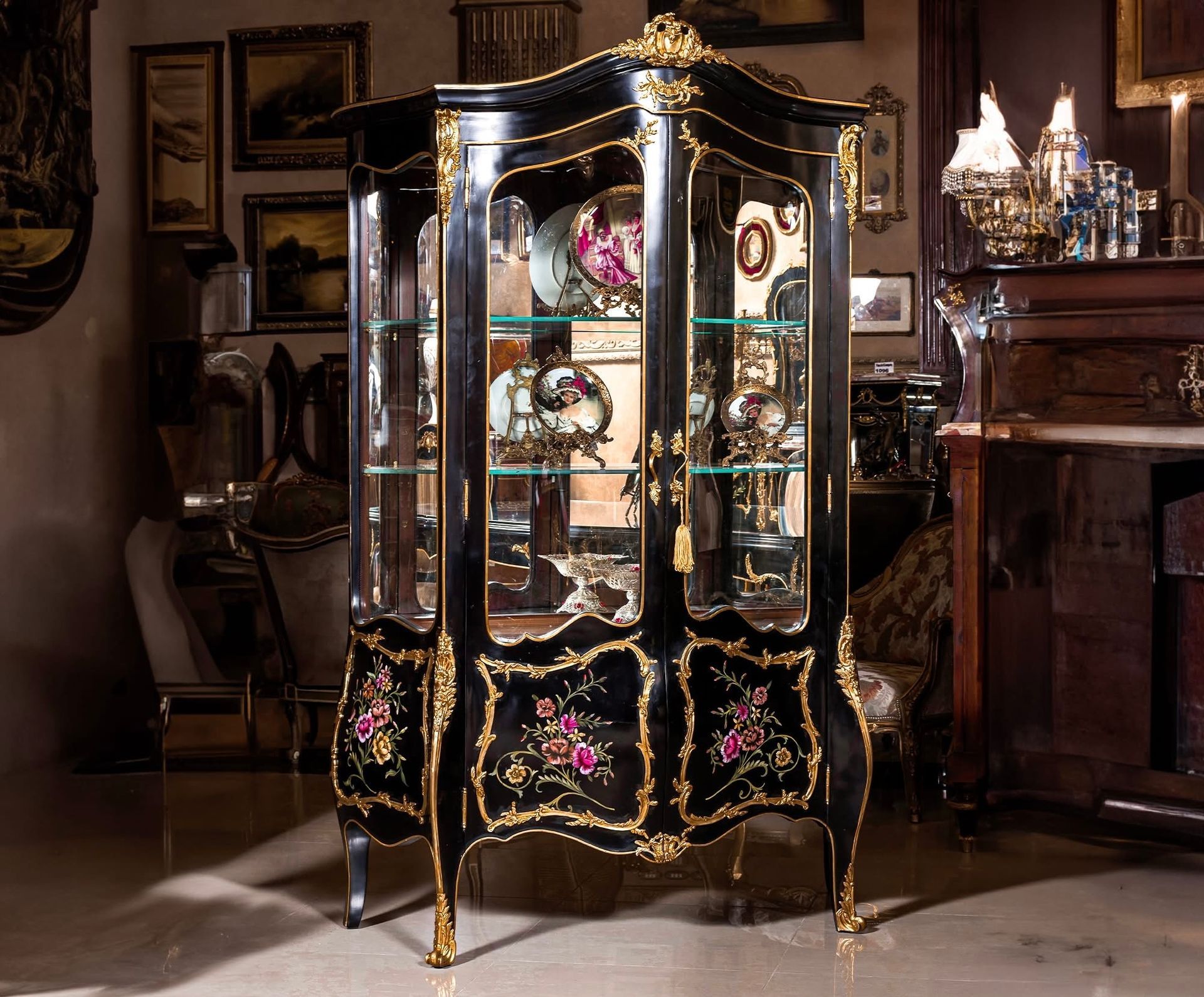A black and gold display case in a living room