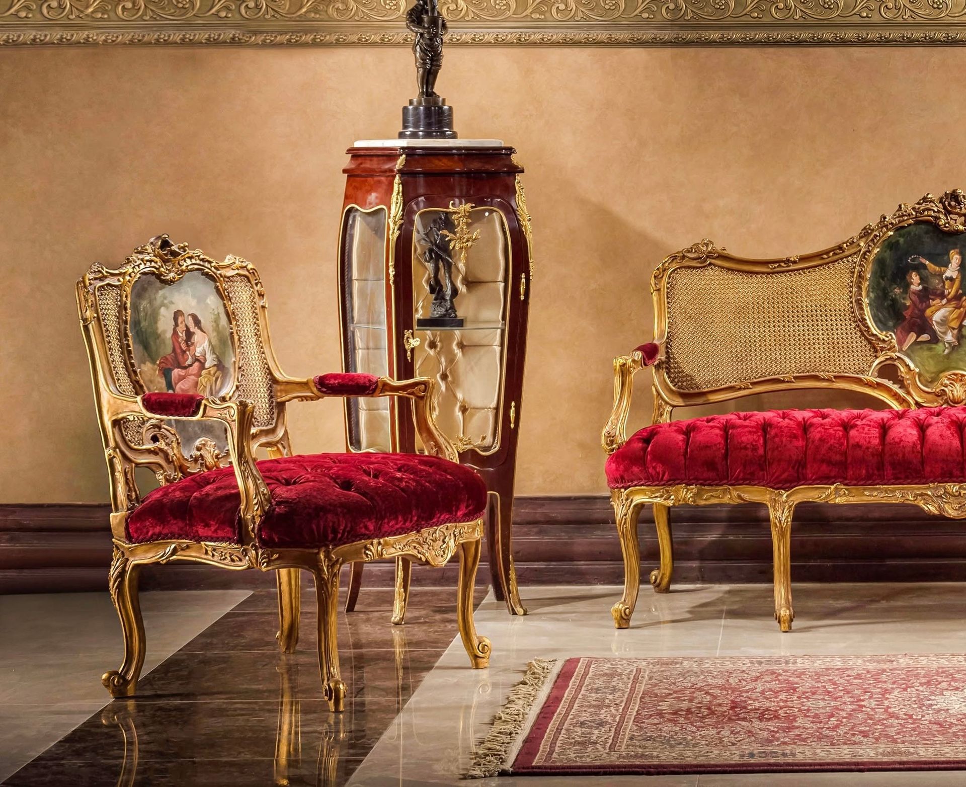 A living room with red chairs and a gold couch