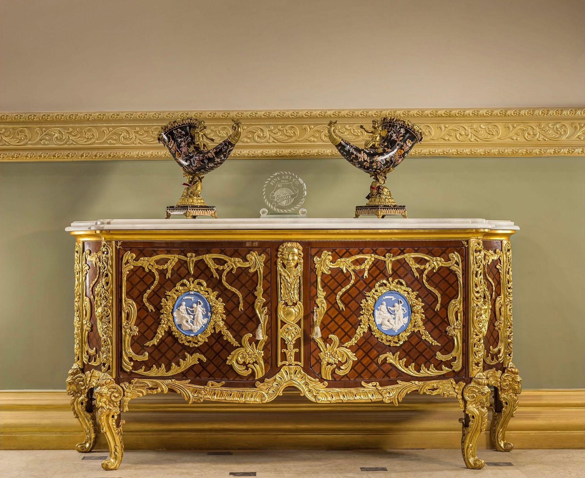 A very ornate dresser with two vases on top of it