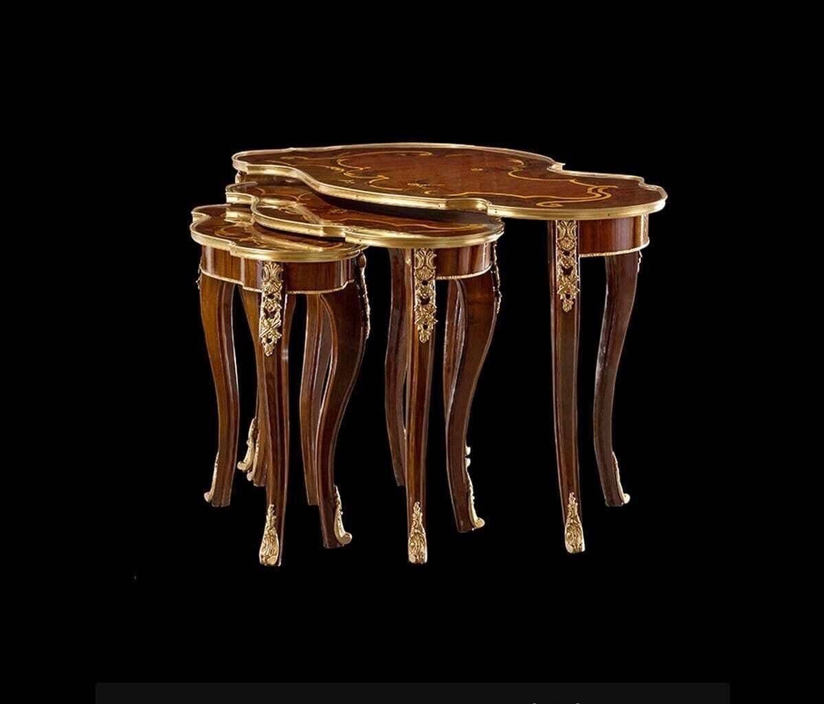 A set of three tables stacked on top of each other on a black background.