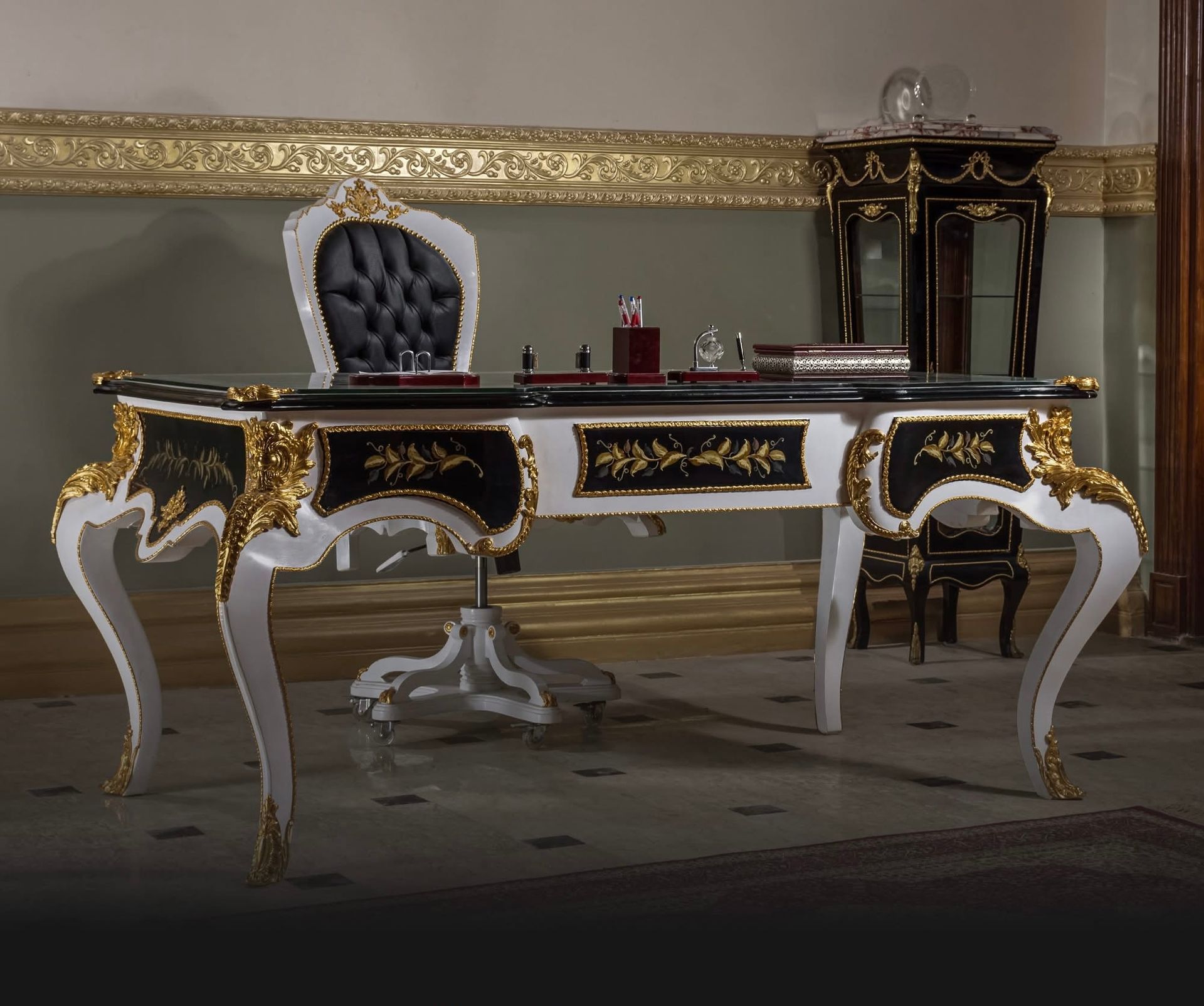 A black and gold desk and chair in a room