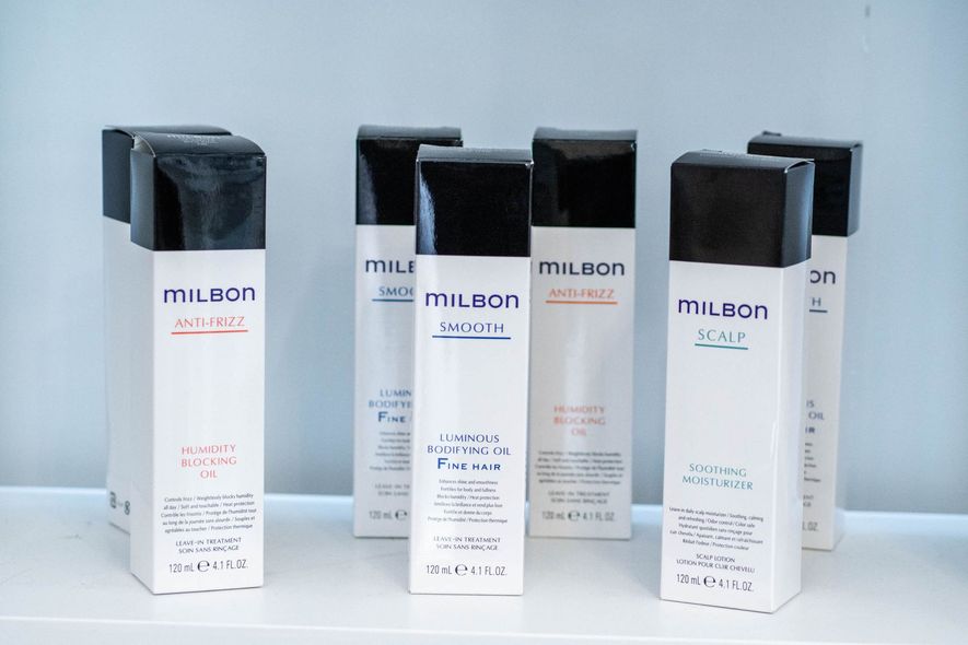 Two beds are sitting next to each other in a room.