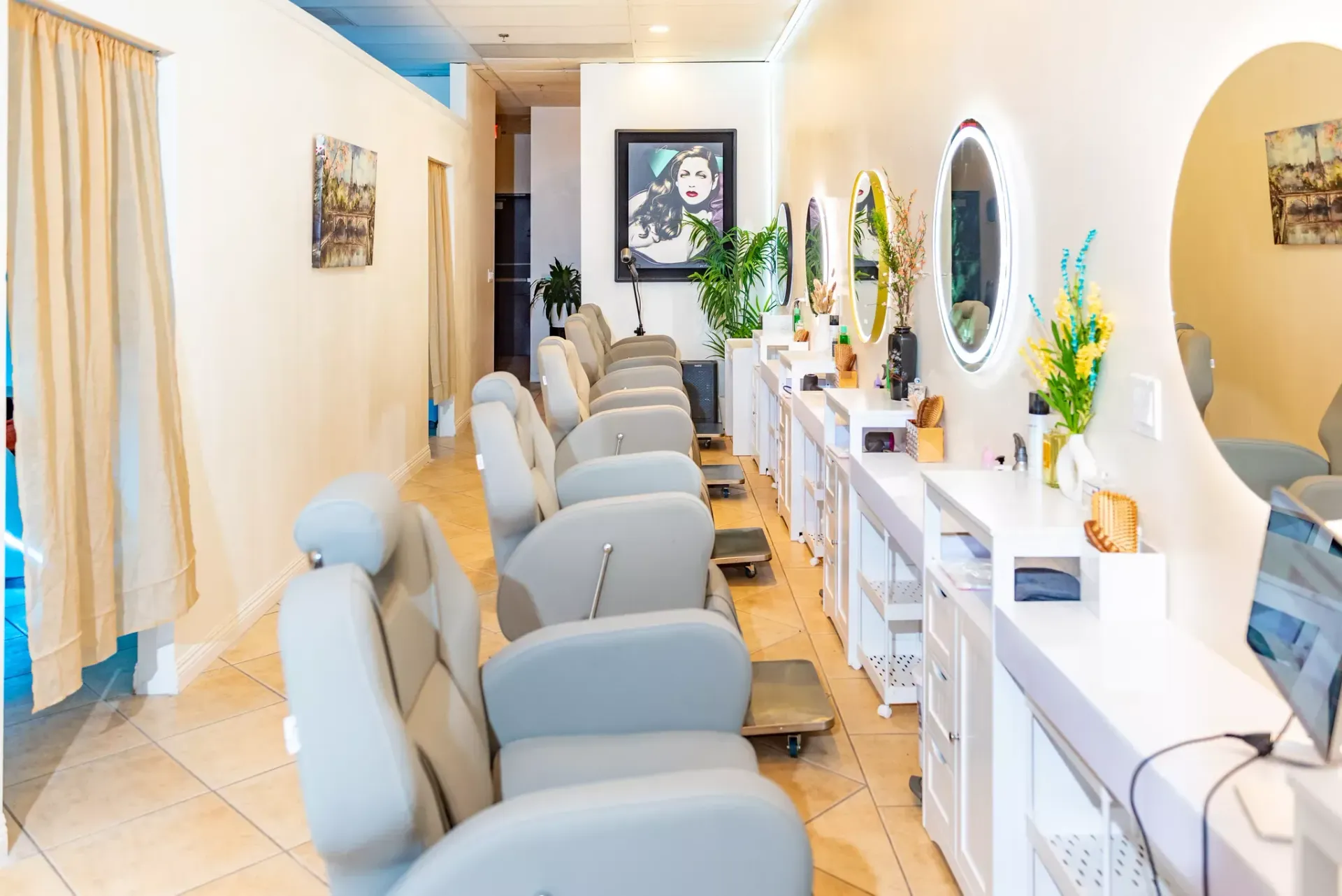 A row of chairs are lined up in a salon.