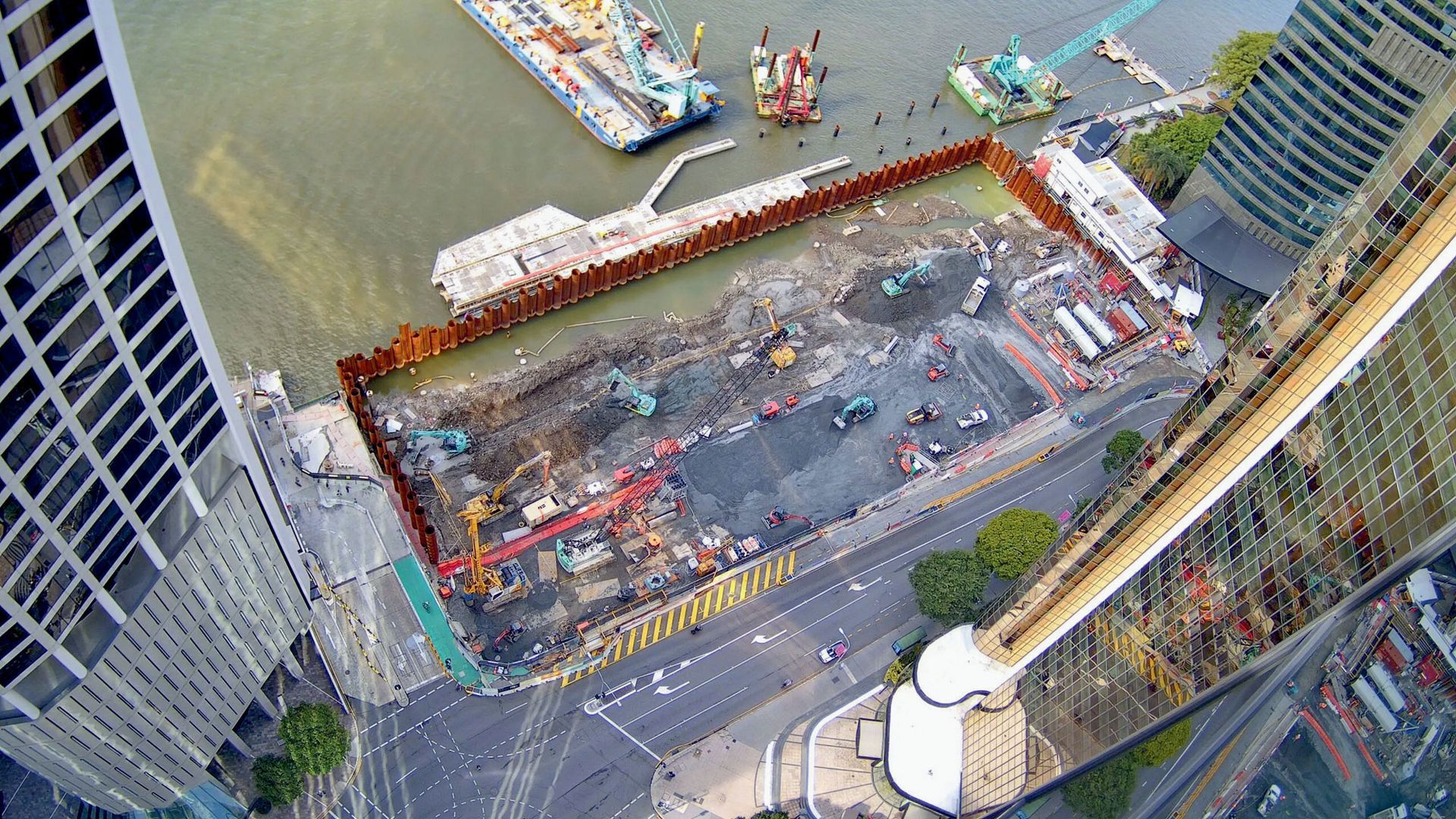 Construction Site Along a Waterfront with Machinery — East Coast Cranes in Ormeau, QLD