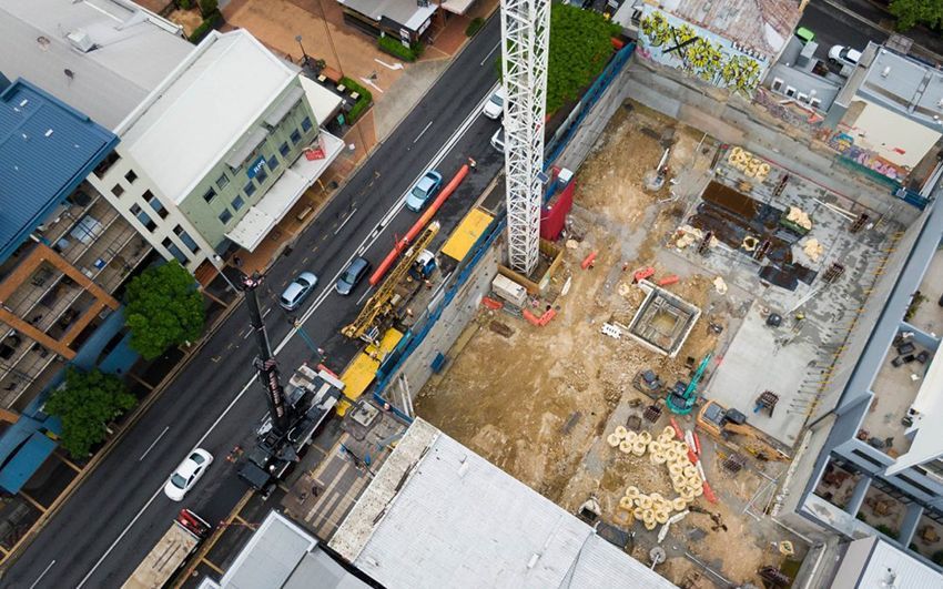An Aerial View of A Construction Site in A City — East Coast Cranes in Ormeau, QLD