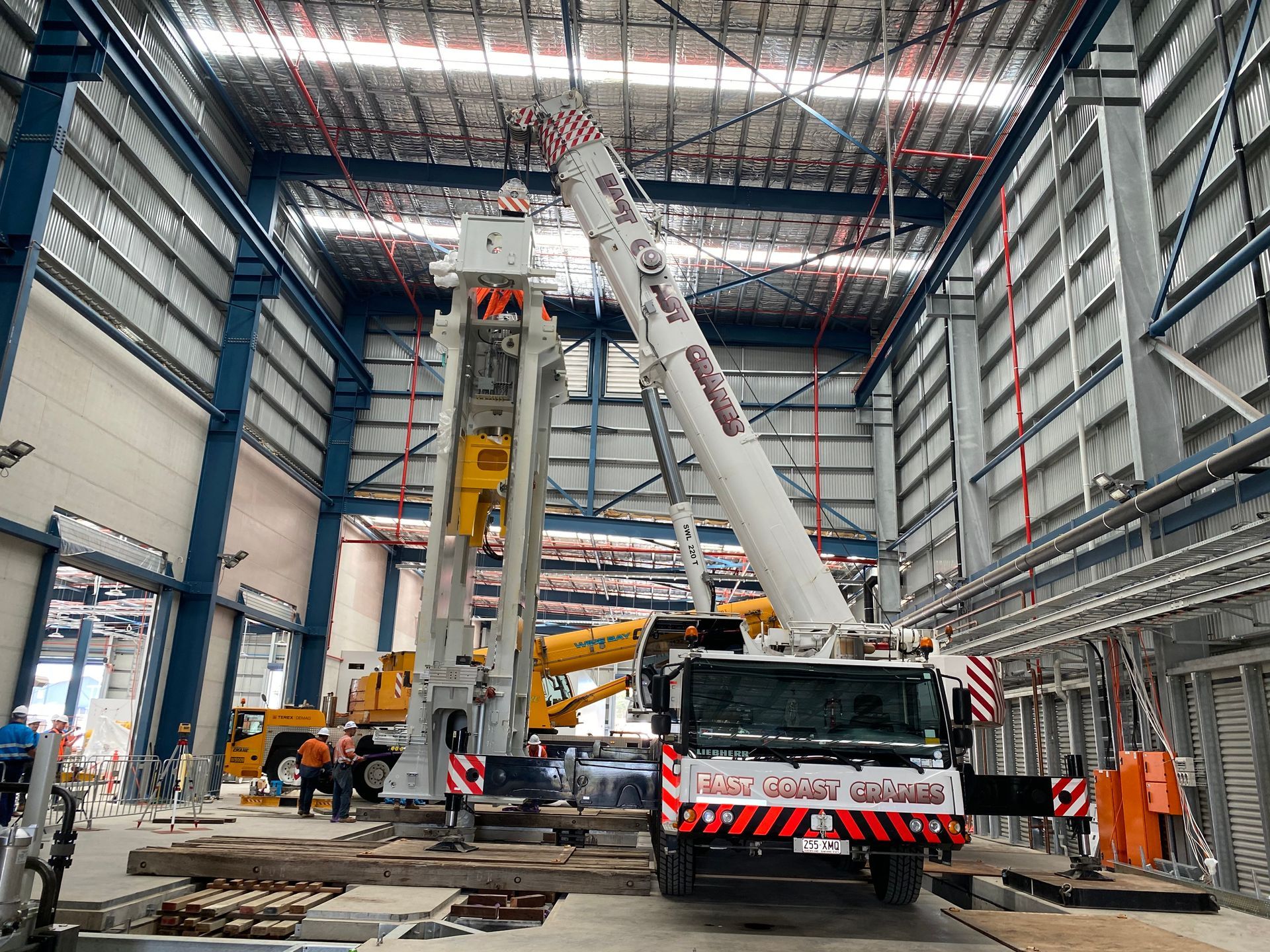 Crane Lifting a Large Industrial Structure Inside a Building — East Coast Cranes in Ormeau, QLD