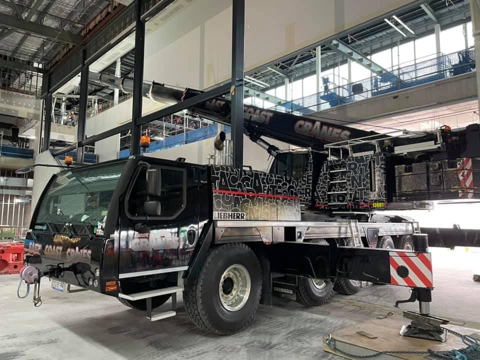 Black Mobile Crane Inside a Building, Ready for Work — East Coast Cranes in Ormeau, QLD