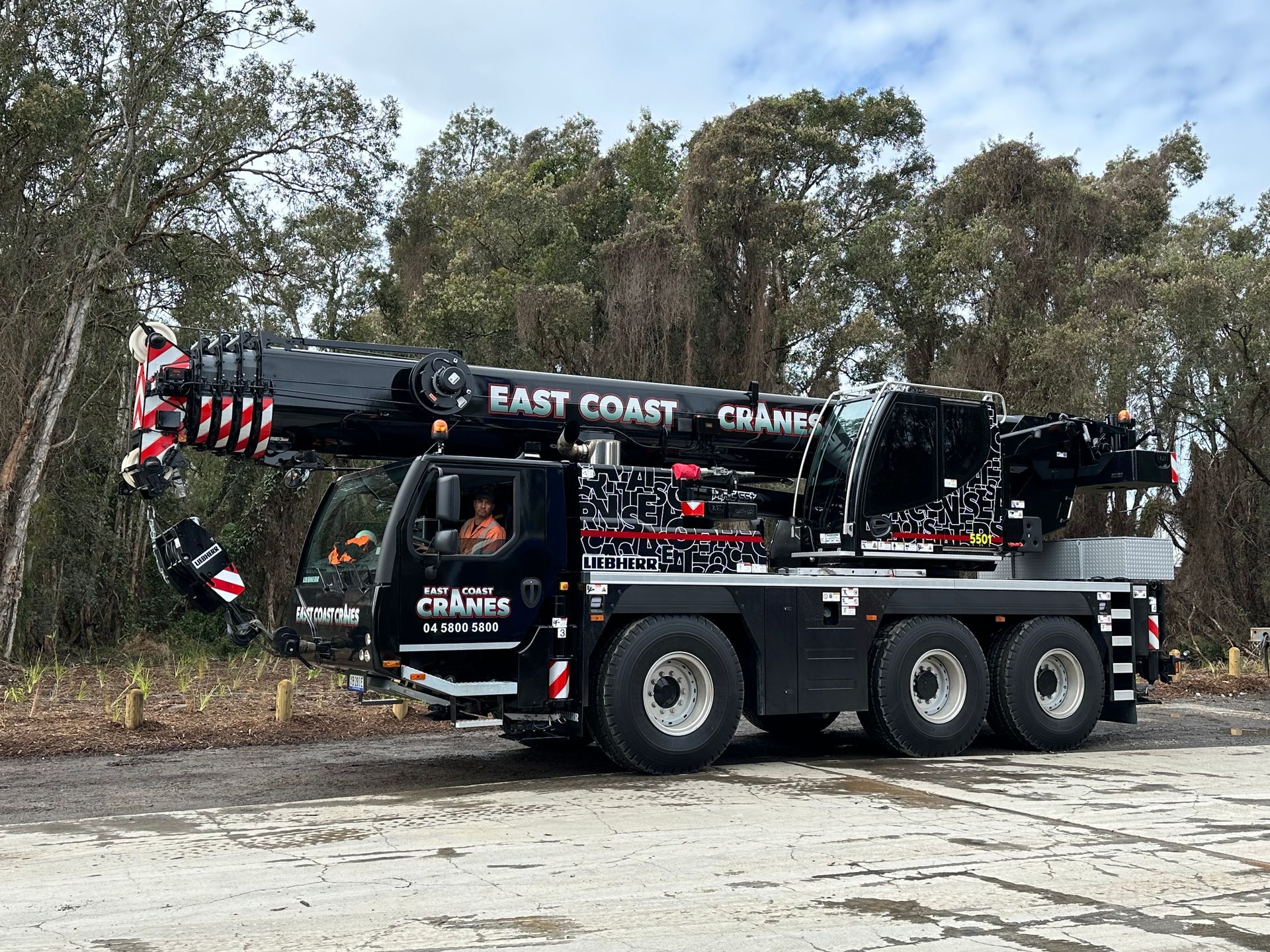 Black Mobile Crane With East Coast Cranes Logo — East Coast Cranes in Ormeau, QLD