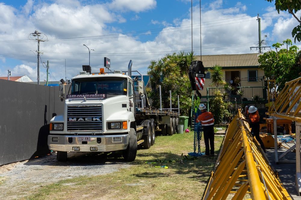 A Mack Truck Is Parked in Front of A Construction Site — East Coast Cranes in Ormeau, QLD