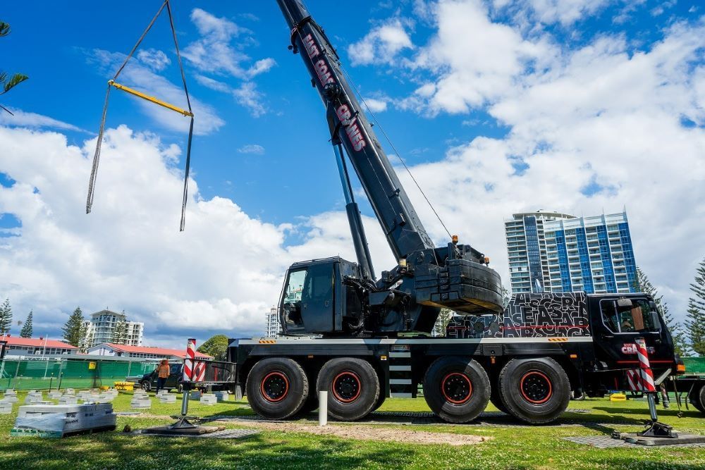 A Large Crane Is Sitting on Top of A Truck in A Park — East Coast Cranes in Ormeau, QLD