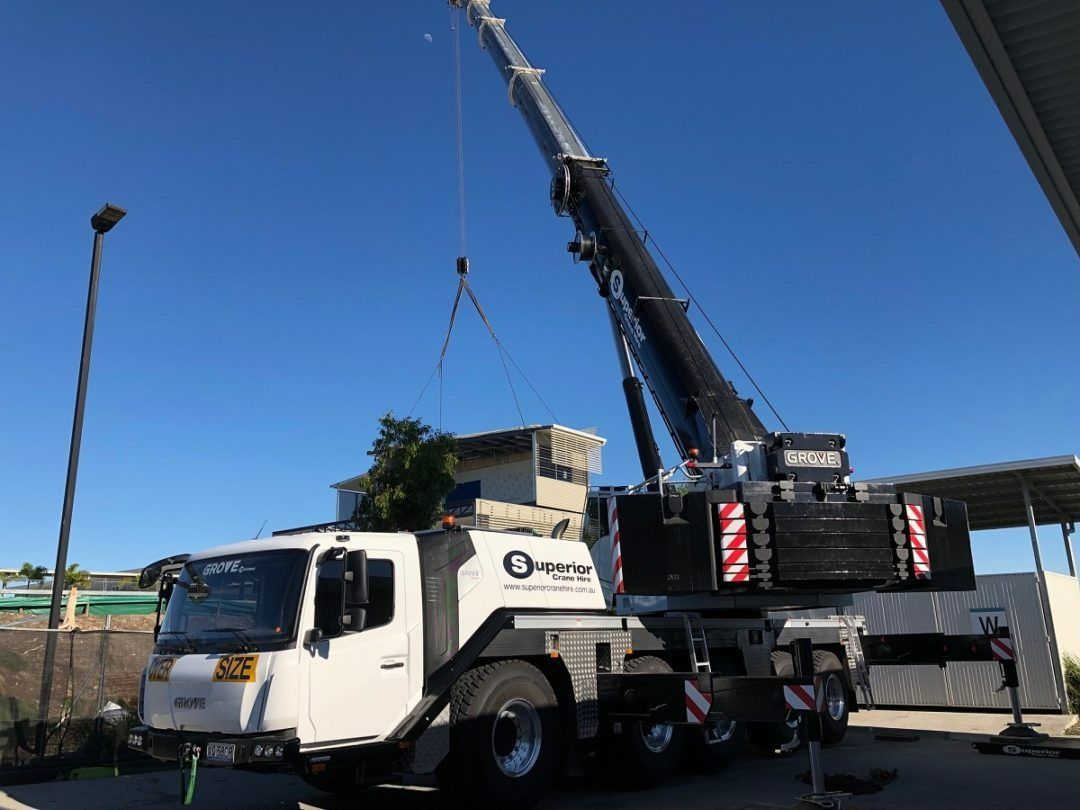 A Large Crane Is Attached to The Back of A White Truck — East Coast Cranes in Ormeau, QLD