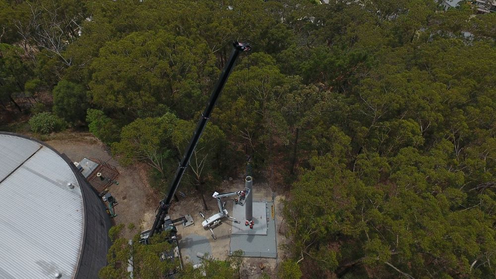 An Aerial View of A Crane in The Middle of A Forest — East Coast Cranes in Ormeau, QLD
