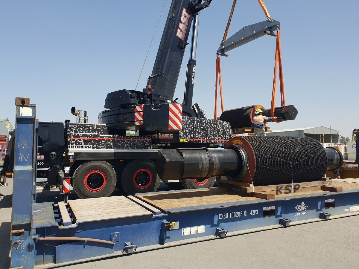A Large Piece of Metal Is Being Lifted by A Crane — East Coast Cranes in Ormeau, QLD