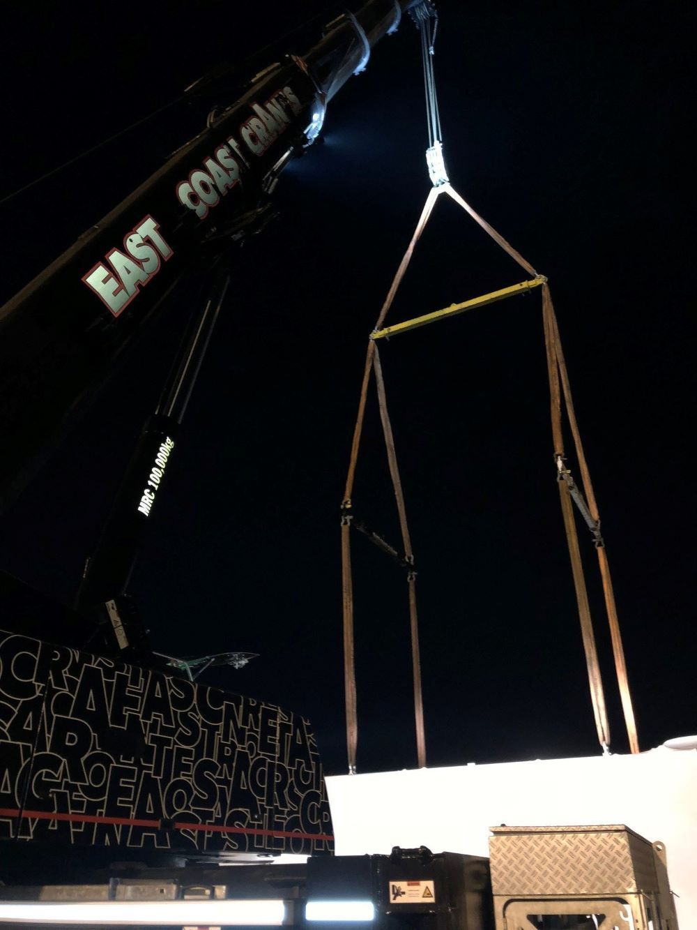 A Large East Coast Crane Is Lifting a Large Object — East Coast Cranes in Ormeau, QLD