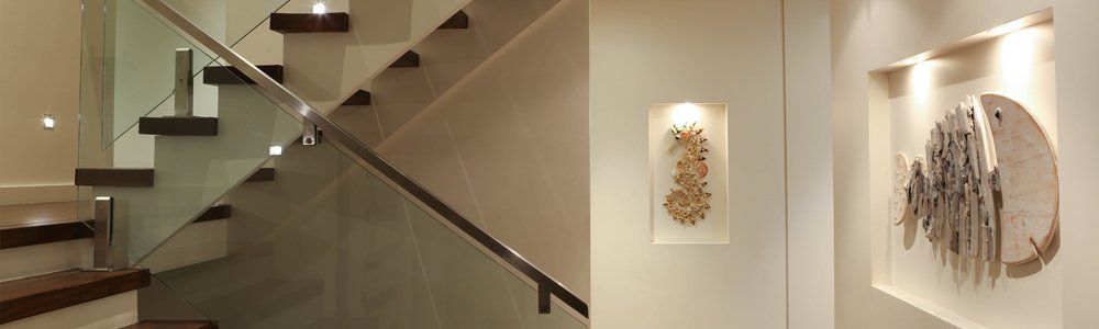 modern stair case with art on walls