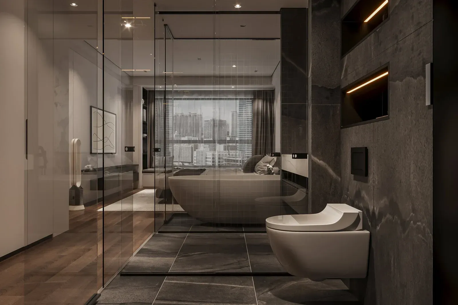 Modern bathroom with a glass-enclosed shower, freestanding tub, and city view. Gray and beige tones dominate.