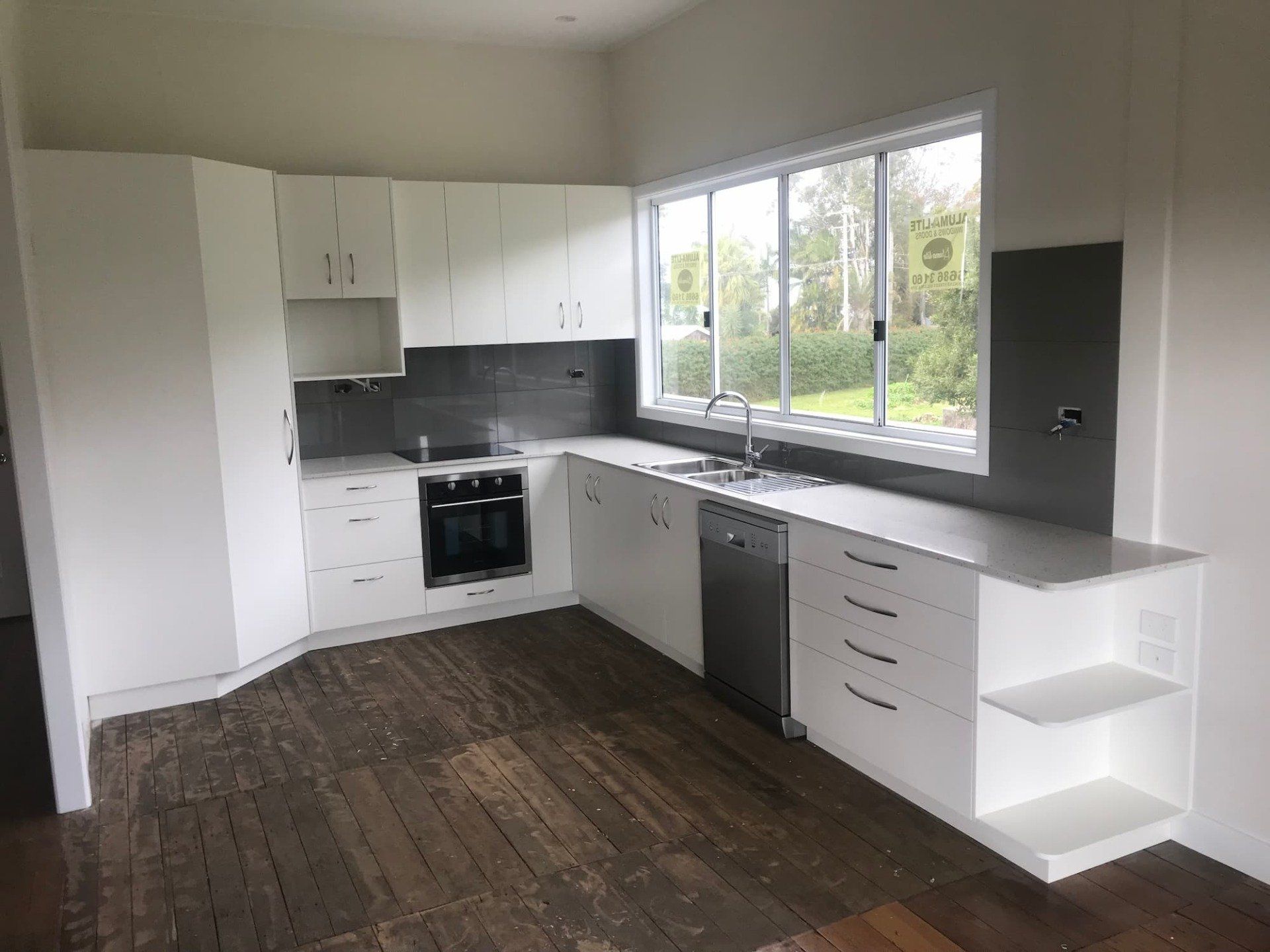 Kitchen with Glossy White Cabinets — Cabinet Makers in the Northern Rivers