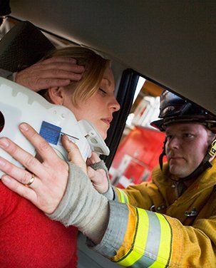 Auto Injury Attorney — Woman Attended by Rescuers During Accident in Indianapolis, IN