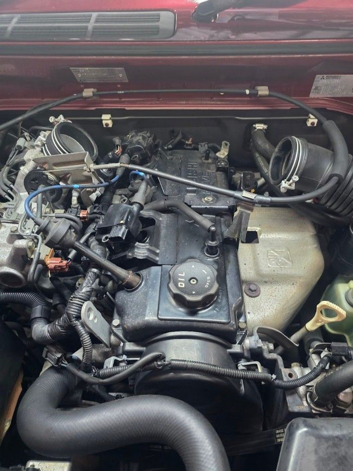 A Close Up Of The Engine Of A Car With The Hood Open — Nuron Inspection & Service Centre In Broadmeadow, NSW