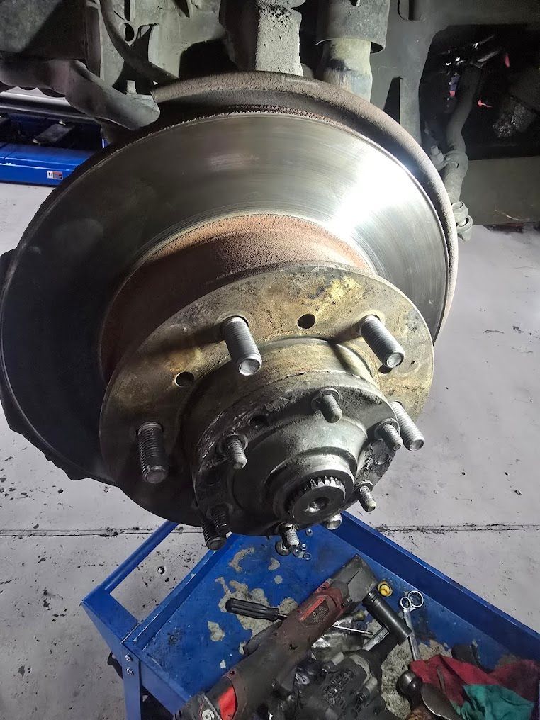 A Close Up Of A Brake Disc On A Car — Nuron Inspection & Service Centre In Broadmeadow, NSW