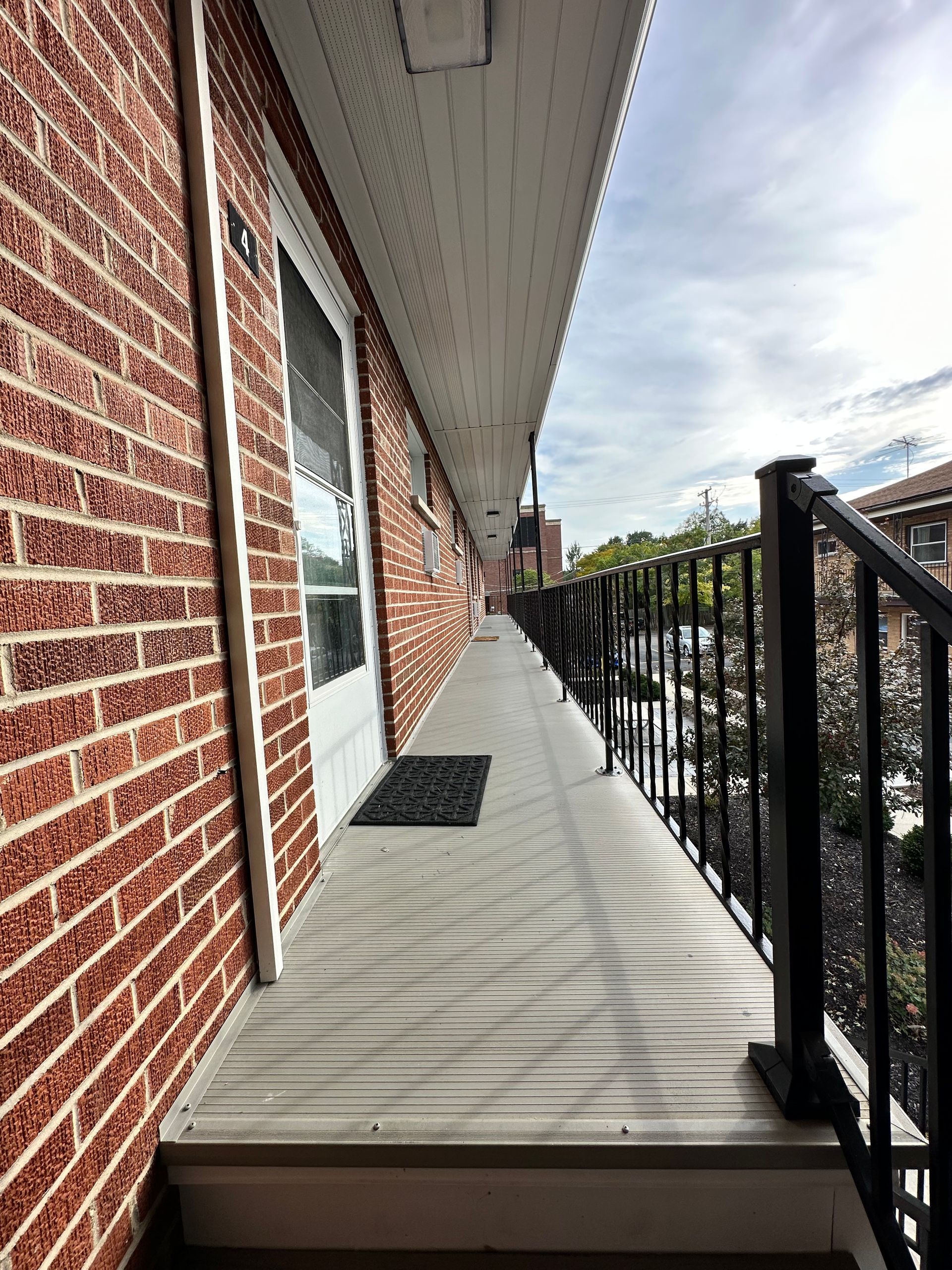 a brick building with a balcony on the side of it
