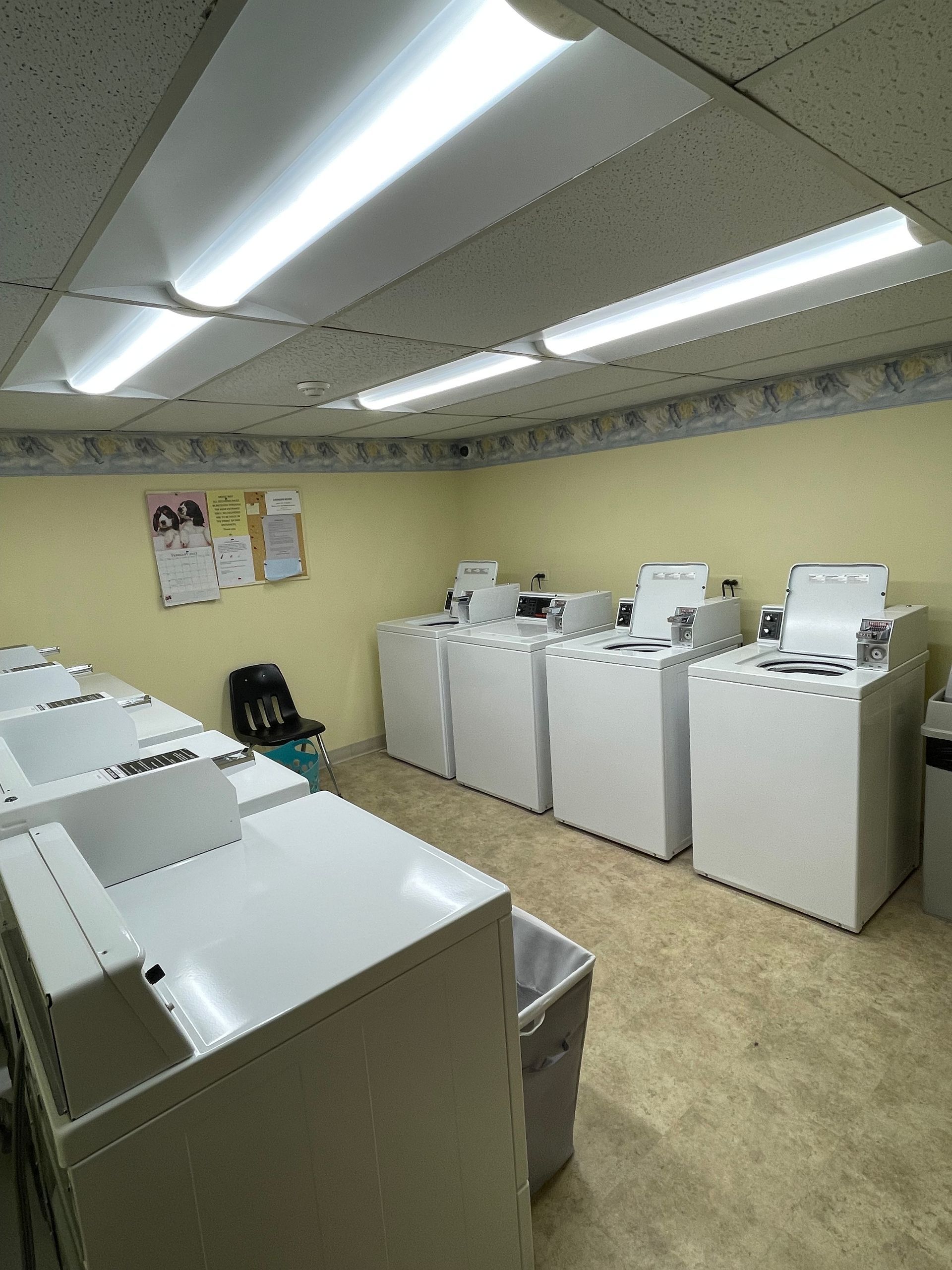a laundromat with a lot of washers and dryers
