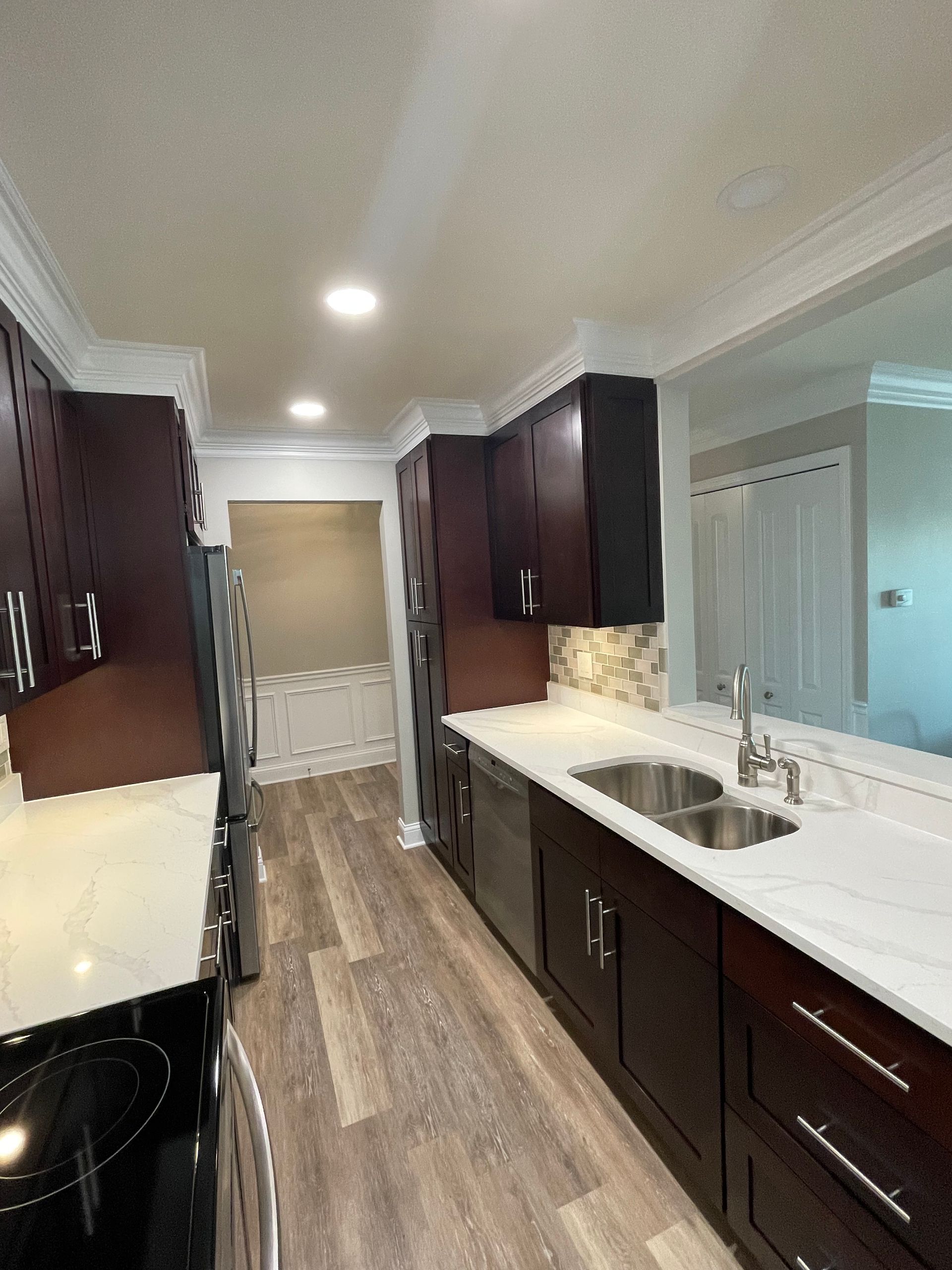 a kitchen with stainless steel appliances and wooden cabinets
