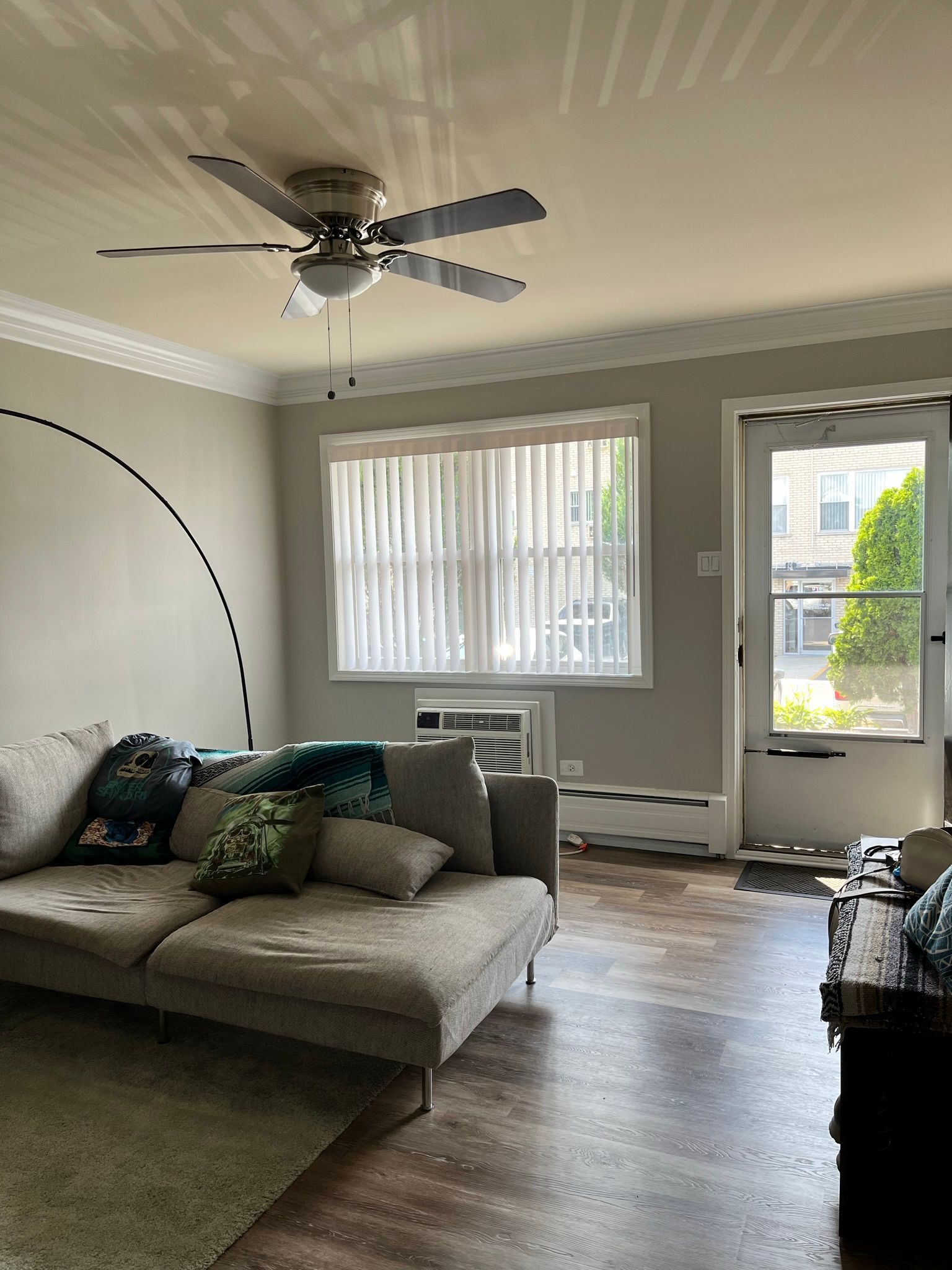 a living room with a couch and a ceiling fan .