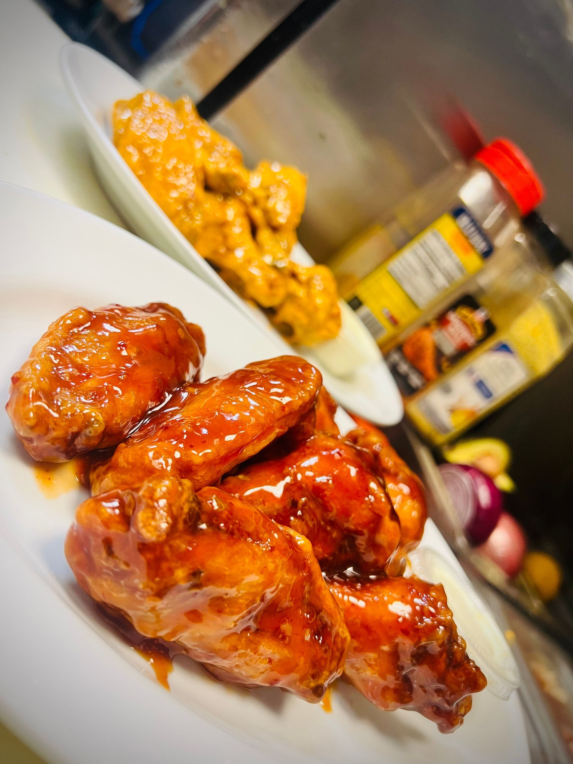 Chicken Wings with Sauce on top of it