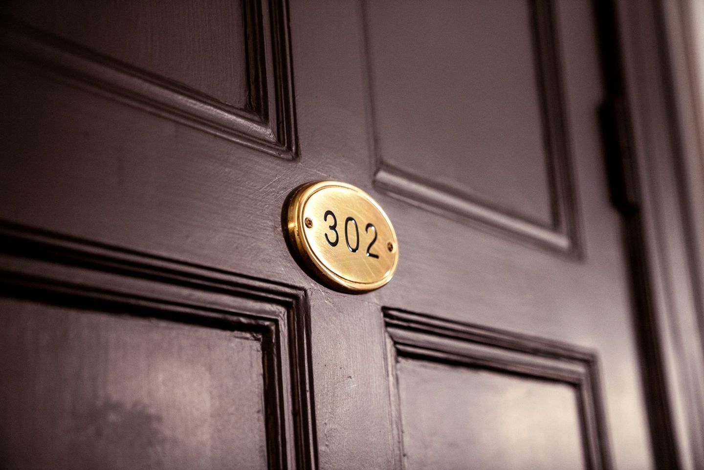 a close up of a door with the number 302 on it
