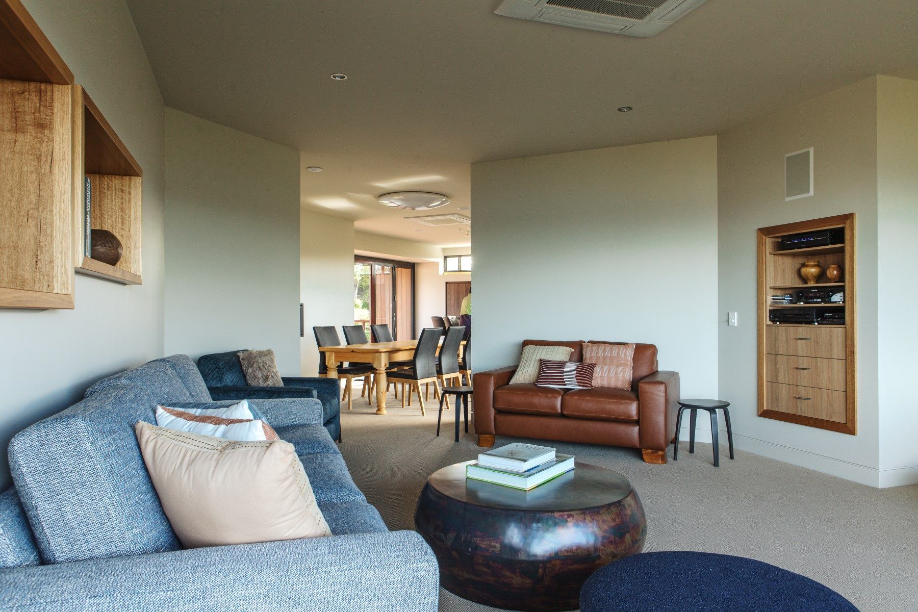 Faraway's living room with a couch, entertainment unit and coffee table.