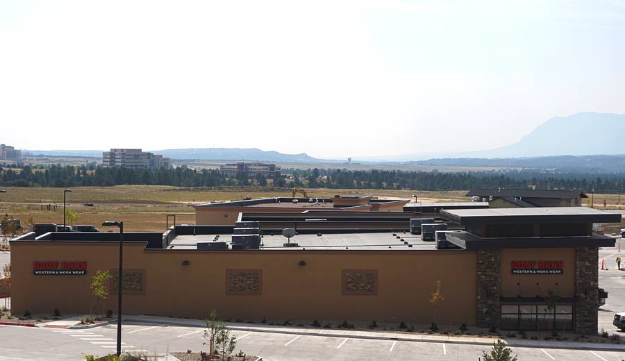 Brown Commercial Building and Mountains — Colorado Springs, CO — McWilliams Roofing