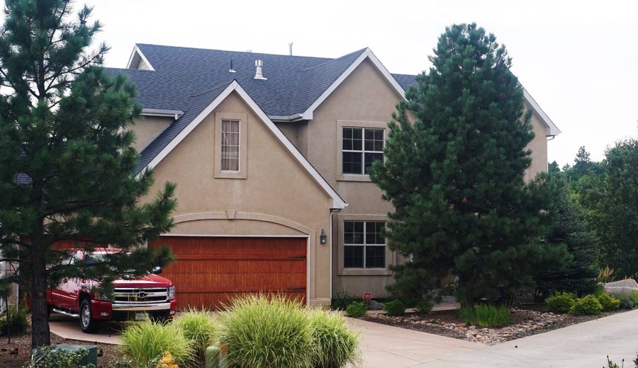 House with Garage and Trees — Colorado Springs, CO — McWilliams Roofing
