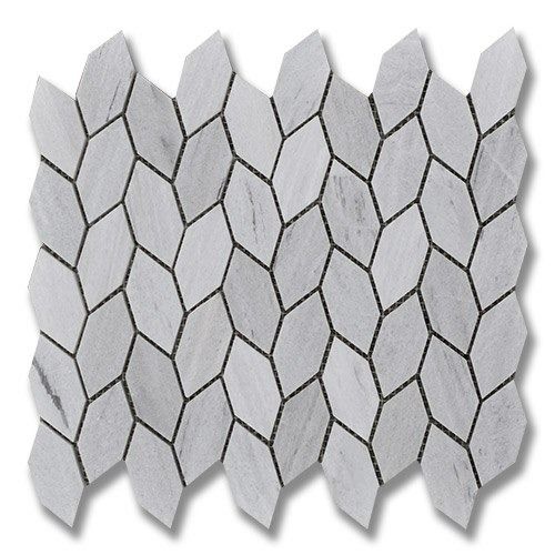 White and gray marble tile in a diamond-shaped pattern with dark grout.