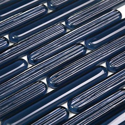 Close-up of navy blue glossy mosaic tile with ribbed texture.