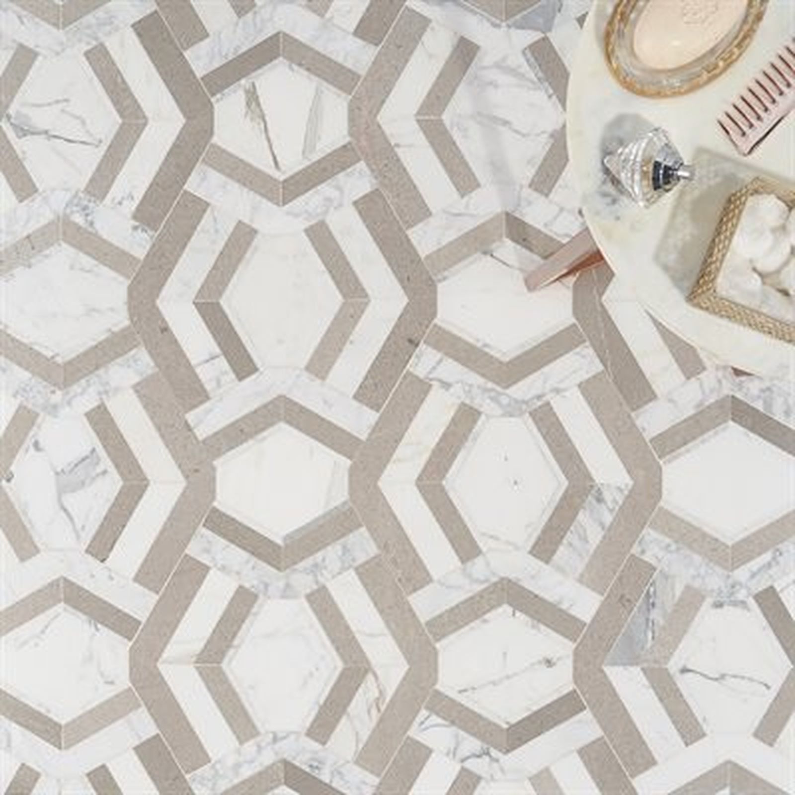 Geometric patterned tile floor with white and gray marble design.