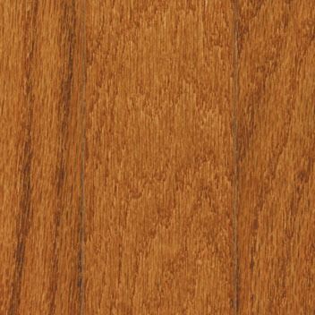 Close-up of hardwood flooring planks in a warm, amber-brown tone with visible wood grain and vertical lines.